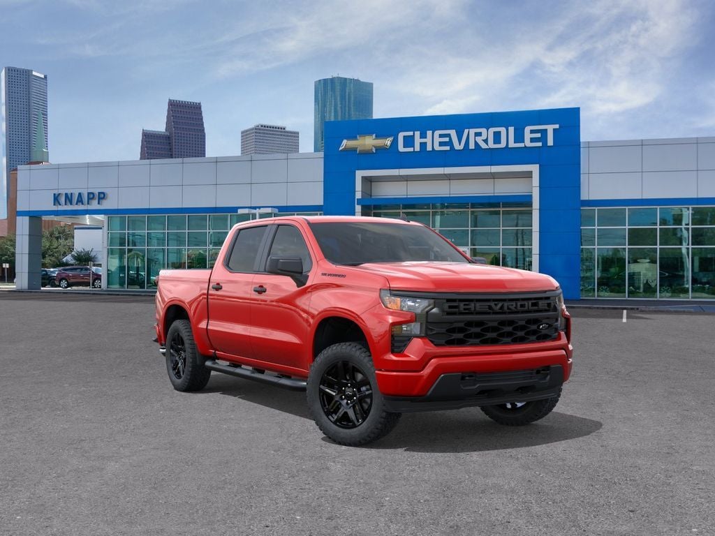 2026 Chevrolet Silverado 1500 Custom in Red Hot — front three-quarter view