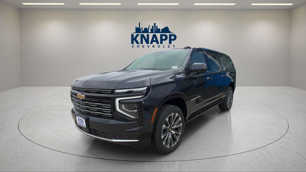 2026 Chevrolet Suburban High Country in Dark Ash Metallic — front three-quarter view