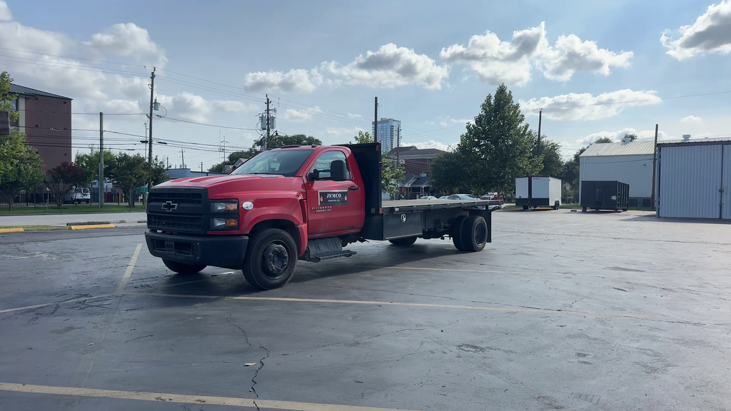 2023 Chevrolet Silverado MD Work Truck in Red Hot — front three-quarter view